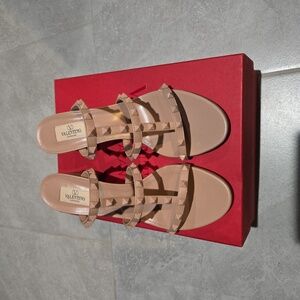I am selling  brand  new  Valentino  Garavani  sandals/slides